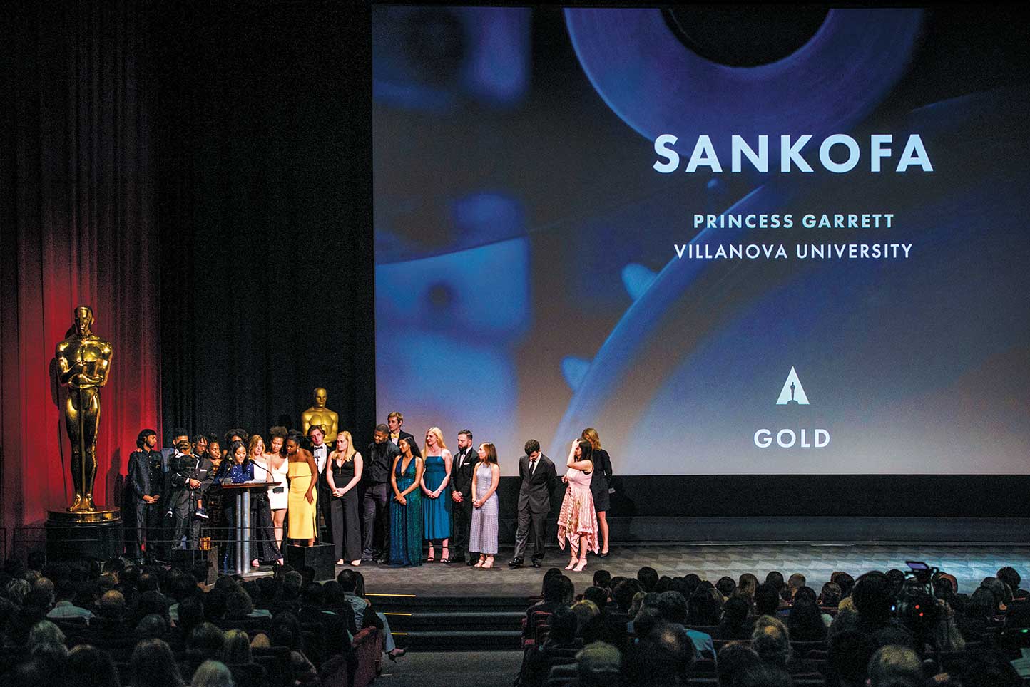 A large group of Villanova students on stage at the Academy Awards