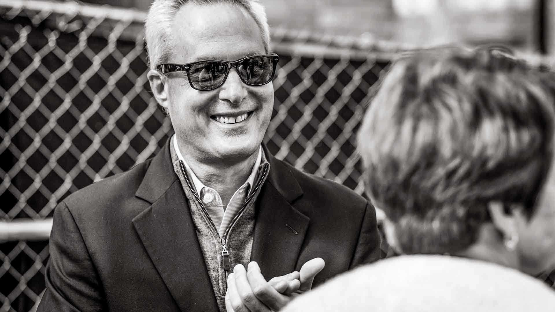 Black and white photo of Ken Valosky wearing sunglasses on construction site