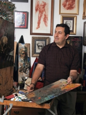 An image of Niko Chocheli standing next to his work