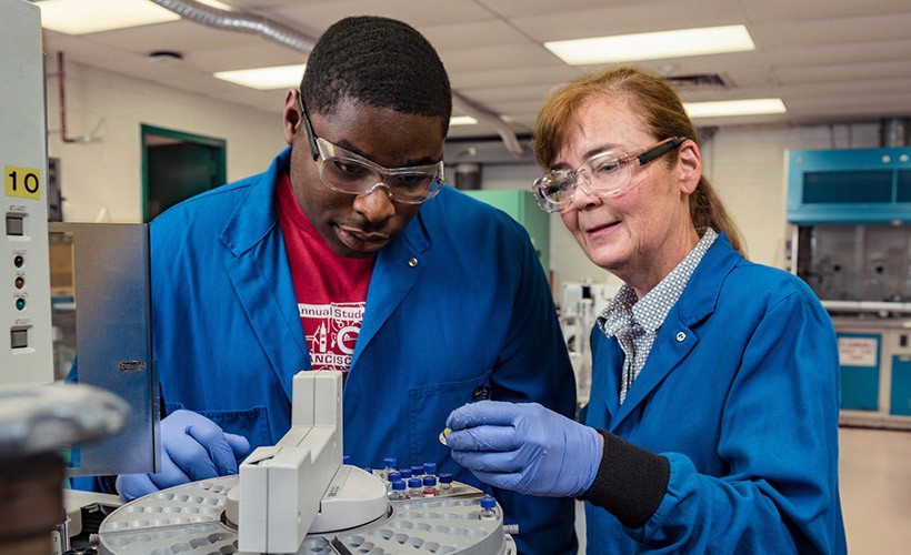 Department of Chemical and Biological Engineering Dorothy Skaf, Associate Professor of Chemical Engineering, works with a student in the lab.
