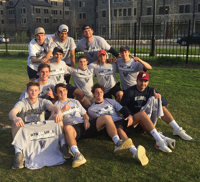 Male students posing for softball champion photo