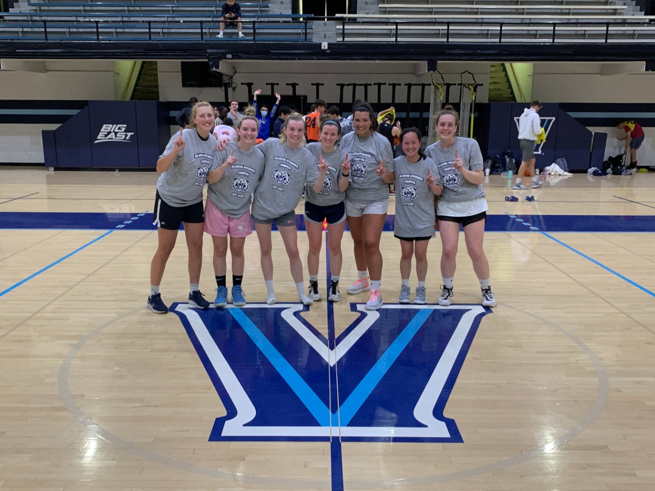 Female students posing for basketball champion photo