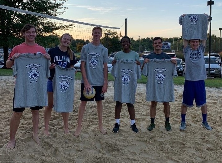 Students posing for sand volleyball champion photo