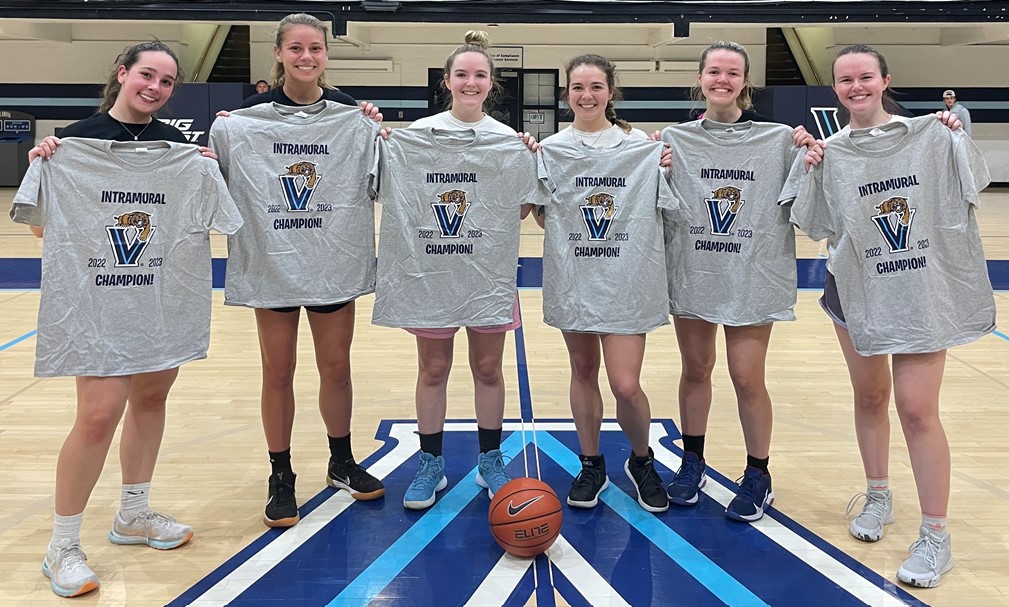 Female students posing for basketball champion photo