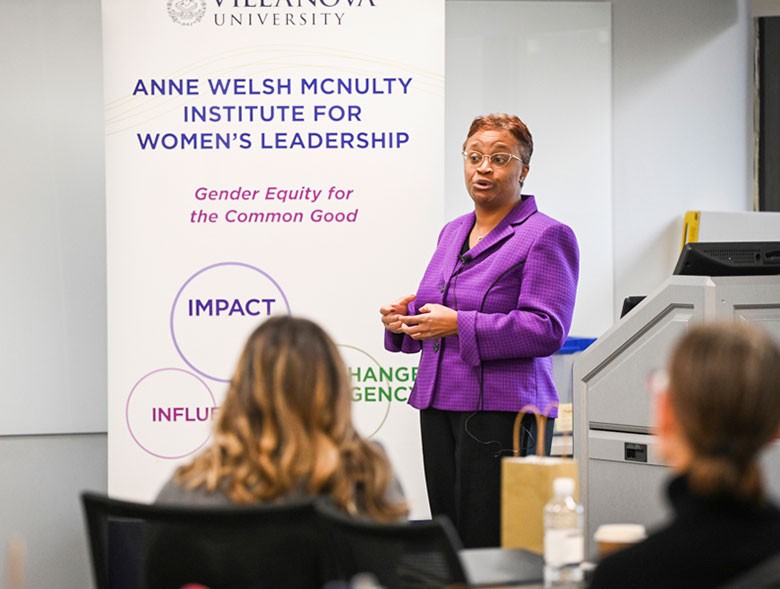 Professor and students sitting