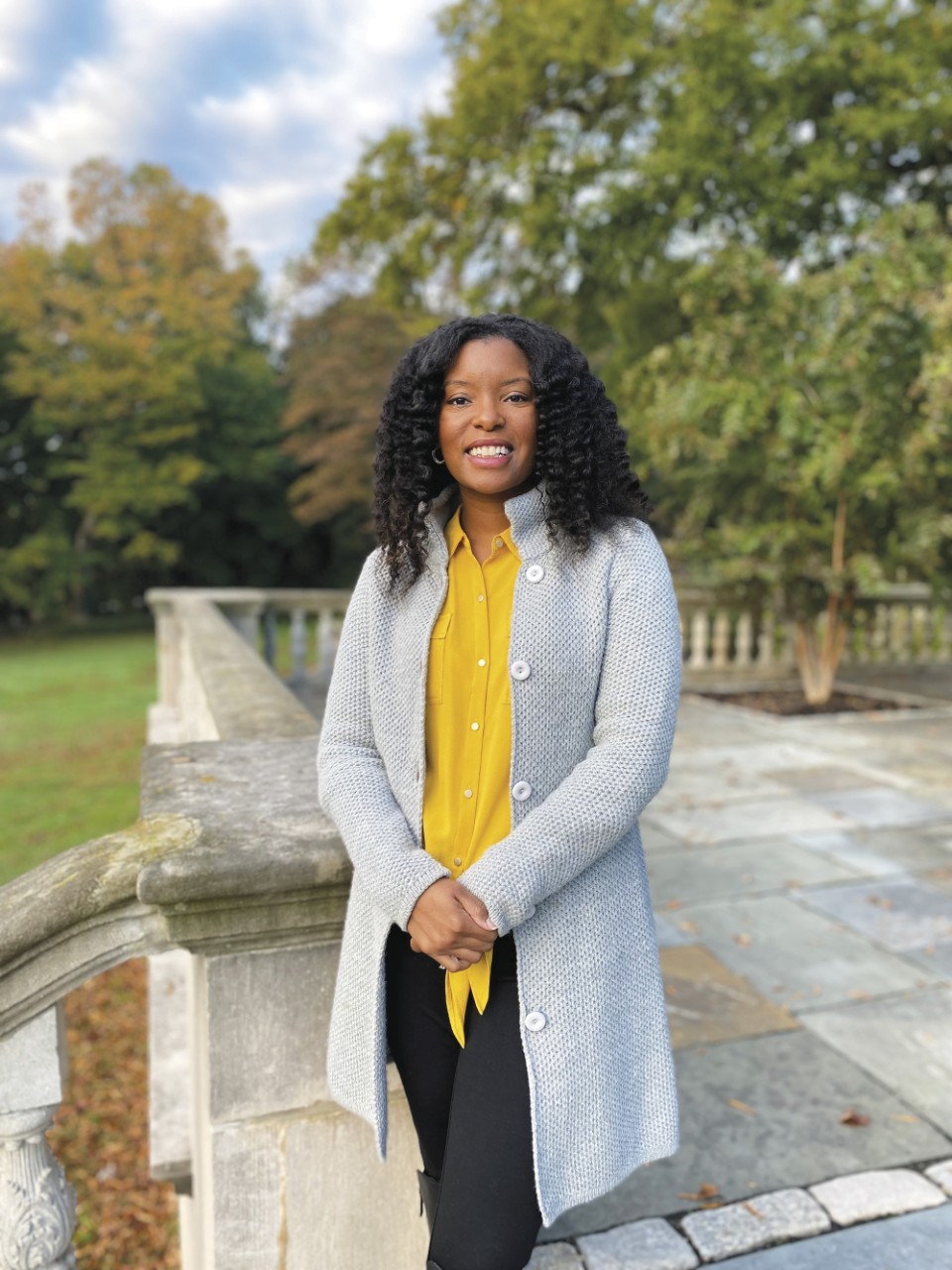 portrait of Tierra Smith standing in front of trees