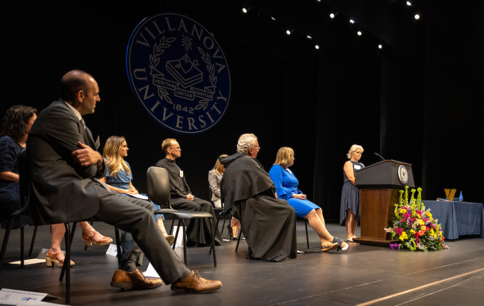 the dais on stage at the CPS Night of Celebration