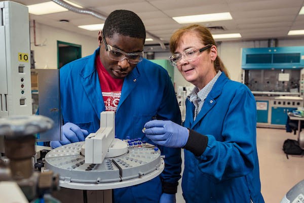 student and faculty working together in a lab