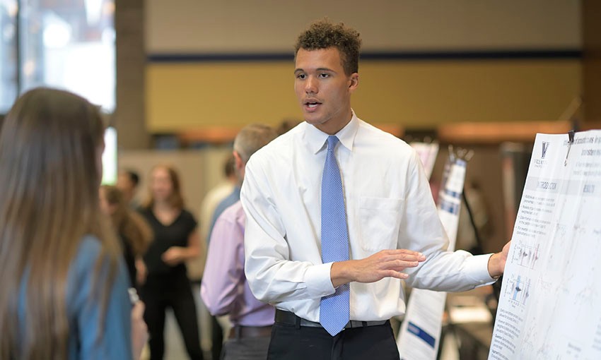 CRF Student presenting research at poster session