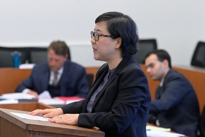 student presenting from podium