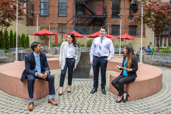 Students speaking to each other outside in a park