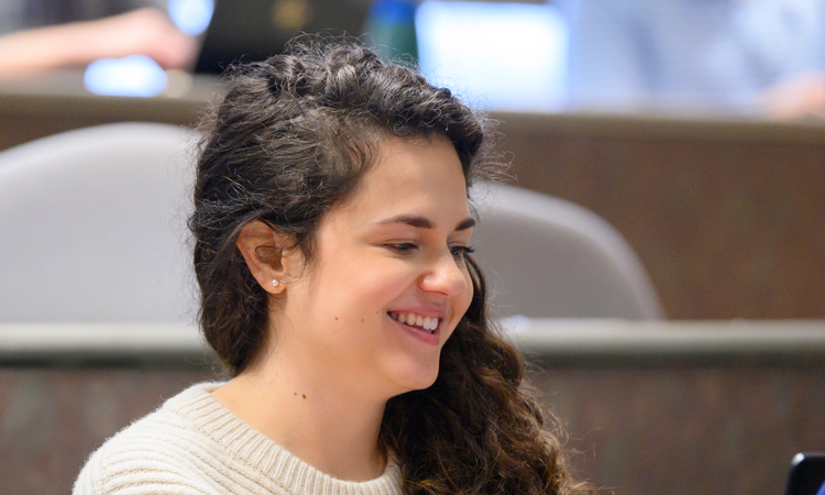 Student Sitting in Front of Computer in Lecture Class