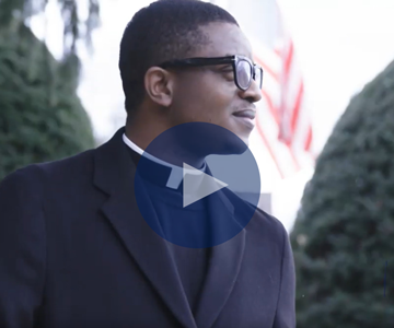 a man with a pencil reading out loud