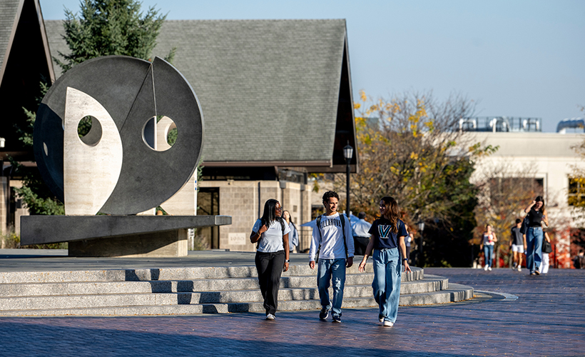 Three Students Walk Along Wildcat Path