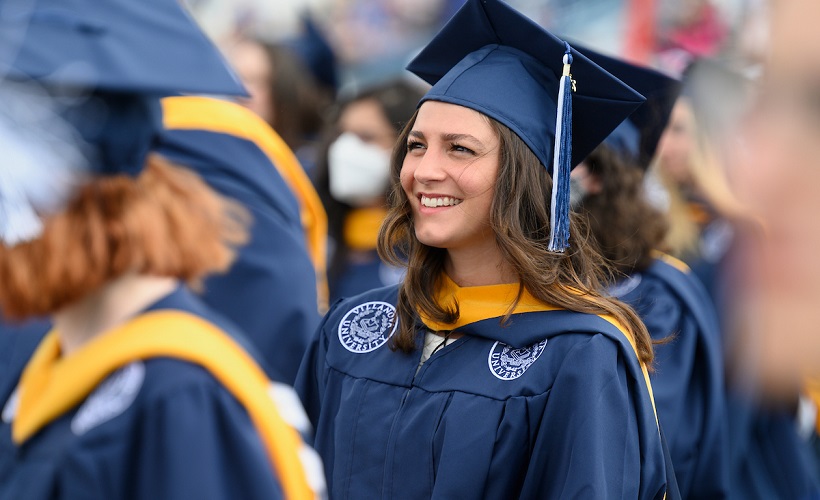 Graduating student wearing graduation cap and gown
