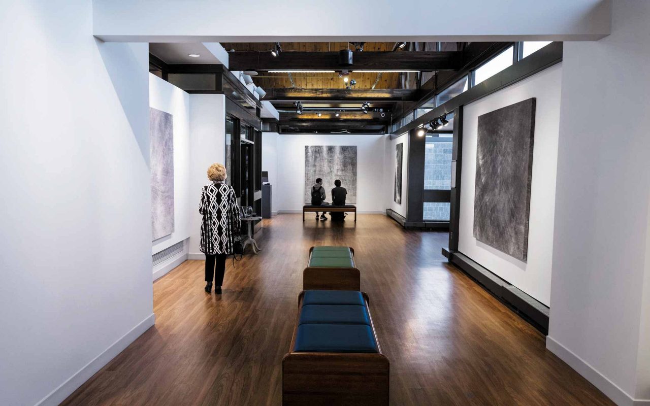 illustration of a stack of books connected to a laptop